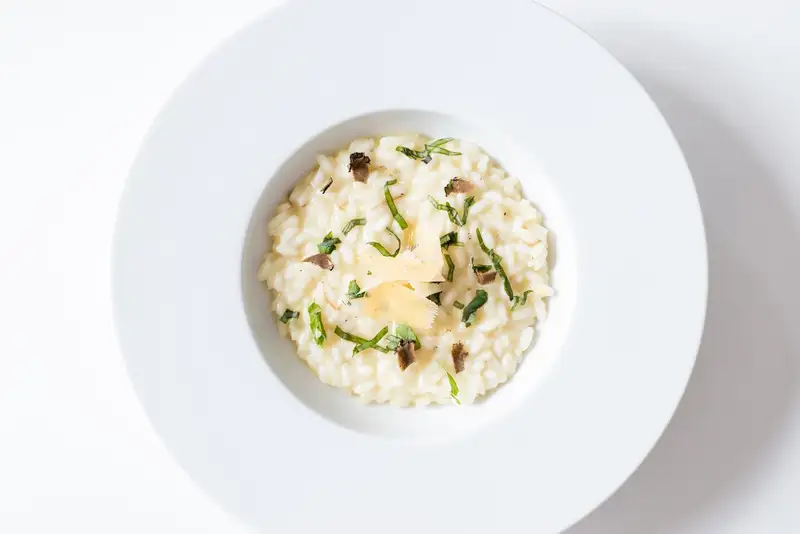 Creamy mushroom risotto topped with herbs