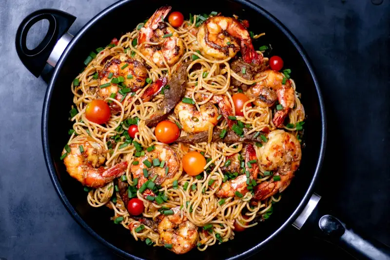 Pasta with mushrooms and herbs in a bowl