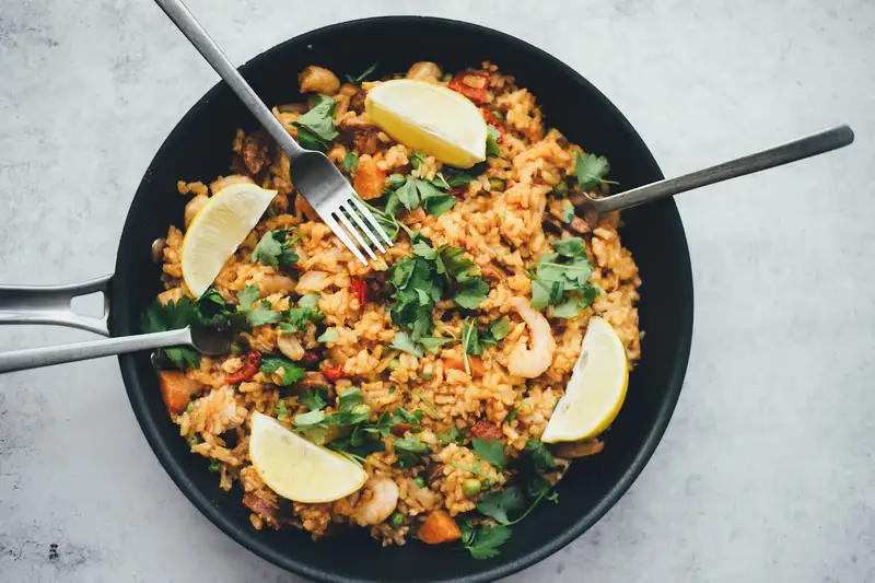 Chicken, tomato, and rice in a pan