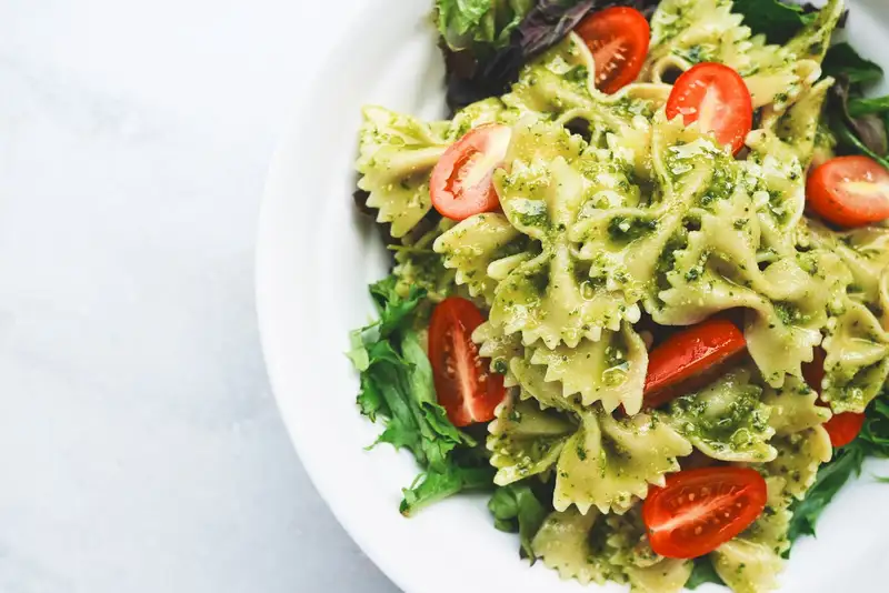 Creamy pasta with herbs in a bowl